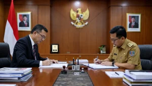Penandatanganan kontrak pengadaan barang jasa pemerintah antara vendor dan pejabat pemerintah Indonesia di ruang rapat resmi